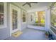 Screened porch provides a peaceful outdoor sitting area at 450 W Delaware Ave, Lake Helen, FL 32744