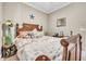 Guest bedroom with a coastal theme and wooden bed frame at 450 W Delaware Ave, Lake Helen, FL 32744