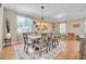 Large dining room with hardwood floors and a rustic table at 450 W Delaware Ave, Lake Helen, FL 32744