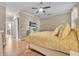 Main bedroom with king bed, large TV, and access to the bathroom at 450 W Delaware Ave, Lake Helen, FL 32744