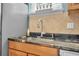 Modern kitchen sink with granite countertops and a pull-down faucet at 450 W Delaware Ave, Lake Helen, FL 32744