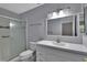 Clean bathroom with a shower, toilet and vanity at 13 Villa Villar # 0, Deland, FL 32724