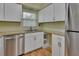 Clean and efficient kitchen with stainless steel appliances and white cabinets at 13 Villa Villar # 0, Deland, FL 32724
