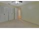 Bedroom with ceiling fan and access to another room at 13 Villa Villar # 0, Deland, FL 32724