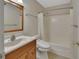 Bathroom with tub, toilet, and wooden vanity at 13 Villa Villar # 0, Deland, FL 32724