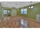 Spacious living room with light-colored laminate flooring and light green walls at 13 Villa Villar # 0, Deland, FL 32724