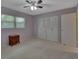 Well-lit bedroom featuring a double door closet at 13 Villa Villar # 0, Deland, FL 32724