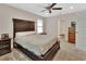 Large bedroom with king-size bed, nightstand, and en-suite bathroom access at 1322 Ferendina Dr, Deltona, FL 32725