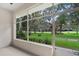 Screened porch overlooking a lush green golf course view at 1117 Athlone Way, Ormond Beach, FL 32174