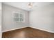 Cozy bedroom with hardwood floors and large window at 1117 Athlone Way, Ormond Beach, FL 32174