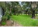 Backyard with a view of the golf course and lush greenery at 1117 Athlone Way, Ormond Beach, FL 32174