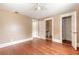Spacious bedroom with hardwood floors, ceiling fan and multiple doors at 724 N Oleander Ave, Daytona Beach, FL 32118
