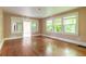 Bright living room with hardwood floors and large windows at 724 N Oleander Ave, Daytona Beach, FL 32118