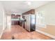 View of kitchen and dining area with terracotta tile floors at 724 N Oleander Ave, Daytona Beach, FL 32118