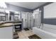 Elegant bathroom with soaking tub, shower, and double vanity at 1401 Bent Oaks Blvd, Deland, FL 32724