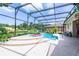 Screened pool and spa with surrounding landscaping at 1401 Bent Oaks Blvd, Deland, FL 32724