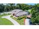 Two-story home with driveway and detached garage at 1401 Bent Oaks Blvd, Deland, FL 32724