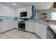 Modern kitchen with white cabinets and stainless steel appliances at 1401 Bent Oaks Blvd, Deland, FL 32724