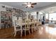 Open concept dining room with hardwood floors and built in shelving at 1401 Bent Oaks Blvd, Deland, FL 32724