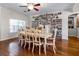 Dining room with a large table and hardwood floors at 1401 Bent Oaks Blvd, Deland, FL 32724