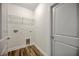 Laundry room with tile floors, shelving, and utility hookups at 210 E Baxter St, De Leon Springs, FL 32130