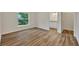 Spacious bedroom with wood-look flooring and an ensuite bathroom at 210 E Baxter St, De Leon Springs, FL 32130