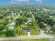 Aerial view of a single-Gathering home and lot at 210 E Baxter St, De Leon Springs, FL 32130