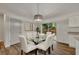 Dining room with glass table and six chairs at 210 E Baxter St, De Leon Springs, FL 32130