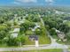 Aerial view showing home's location and neighborhood at 210 E Baxter St, De Leon Springs, FL 32130