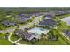 Aerial view showing neighborhood homes and a community pool area at 6287 Woodhaven Village Dr, Port Orange, FL 32128