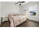 Spacious bedroom with light wood flooring and a comfortable bed at 6287 Woodhaven Village Dr, Port Orange, FL 32128