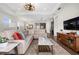 Spacious living room with sectional sofa and large flat-screen TV at 6287 Woodhaven Village Dr, Port Orange, FL 32128