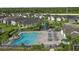 Community pool with lounge chairs, umbrellas, and a playground nearby at 6287 Woodhaven Village Dr, Port Orange, FL 32128