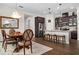 Open concept kitchen with island, stainless steel appliances, and hardwood floors at 6287 Woodhaven Village Dr, Port Orange, FL 32128