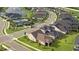 Aerial view of a house with a pool in a community setting at 6287 Woodhaven Village Dr, Port Orange, FL 32128