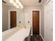 Bathroom with double vanity and wood-look floors at 34 Fairway Dr # 1, Debary, FL 32713