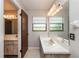 Clean bathroom with updated vanity and mirror at 34 Fairway Dr # 1, Debary, FL 32713