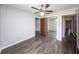 Spacious bedroom with mirrored closet doors and a ceiling fan at 34 Fairway Dr # 1, Debary, FL 32713