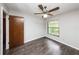 Bedroom with dark hardwood floors and ceiling fan at 34 Fairway Dr # 1, Debary, FL 32713