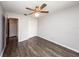 Spacious bedroom with wood-look floors and ceiling fan at 34 Fairway Dr # 1, Debary, FL 32713