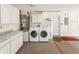 Garage with built-in cabinets and laundry hookups at 34 Fairway Dr # 1, Debary, FL 32713