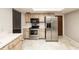 Kitchen boasts stainless steel appliances and wood cabinets at 34 Fairway Dr # 1, Debary, FL 32713