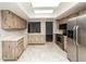 Updated kitchen with stainless steel appliances and wood cabinets at 34 Fairway Dr # 1, Debary, FL 32713