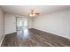 Living room with wood-look floors and sliding glass doors at 34 Fairway Dr # 1, Debary, FL 32713