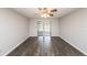 Living room with wood-look floors and sliding glass doors at 34 Fairway Dr # 1, Debary, FL 32713