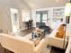 Open living space with comfortable seating and a view into the kitchen at 34 Fairway Dr # 1, Debary, FL 32713