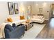 Bright living room with comfy sofas, a coffee table, and wood-look floors at 34 Fairway Dr # 1, Debary, FL 32713