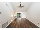 Spacious living room with high ceilings and wood-look floors at 34 Fairway Dr # 1, Debary, FL 32713