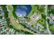 An aerial view of a residential area, highlighting a villa near a lake at 34 Fairway Dr # 1, Debary, FL 32713