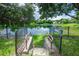 Steps down to lake with lush green grass at 34 Fairway Dr # 1, Debary, FL 32713